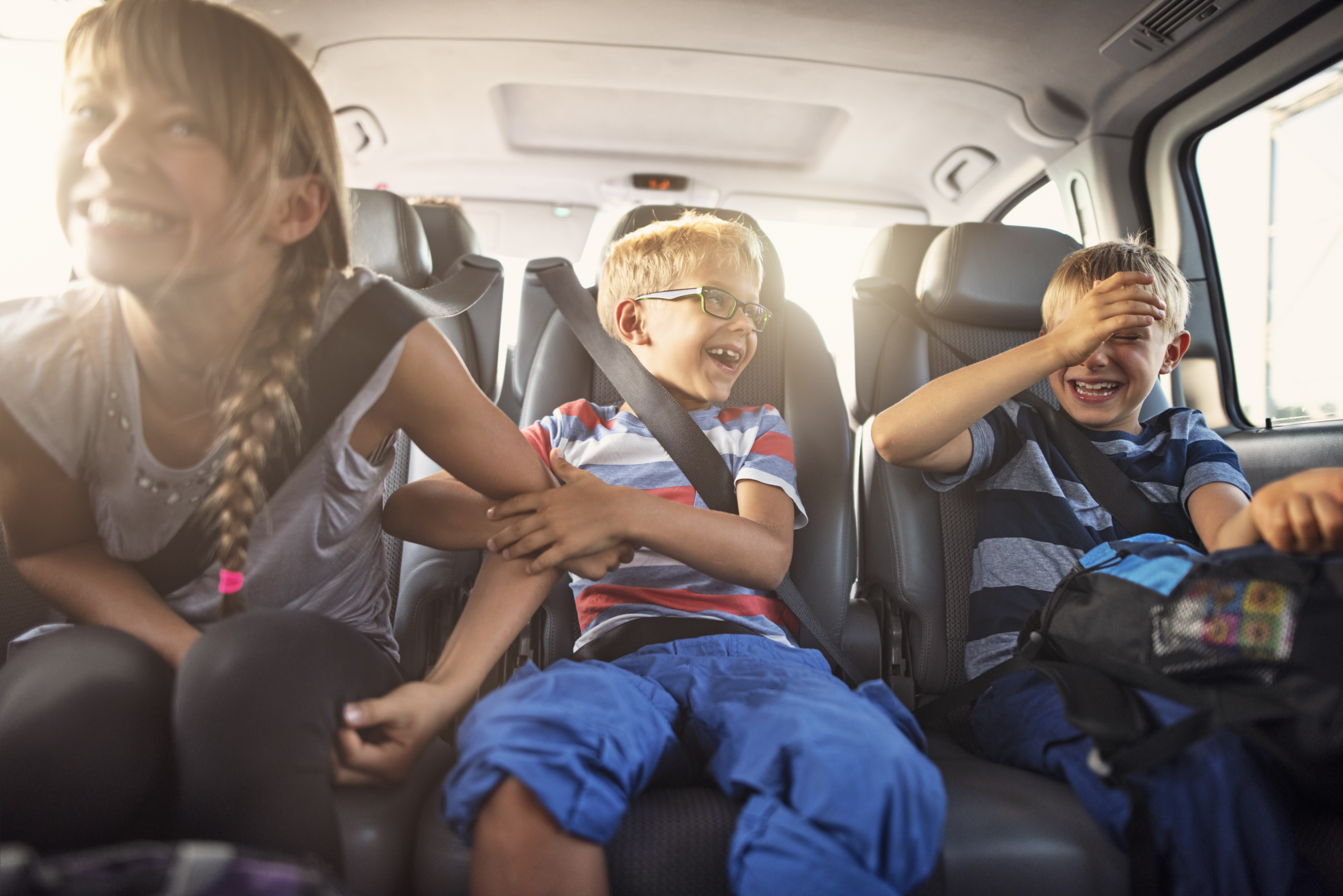 Children traveling in a vehicle.