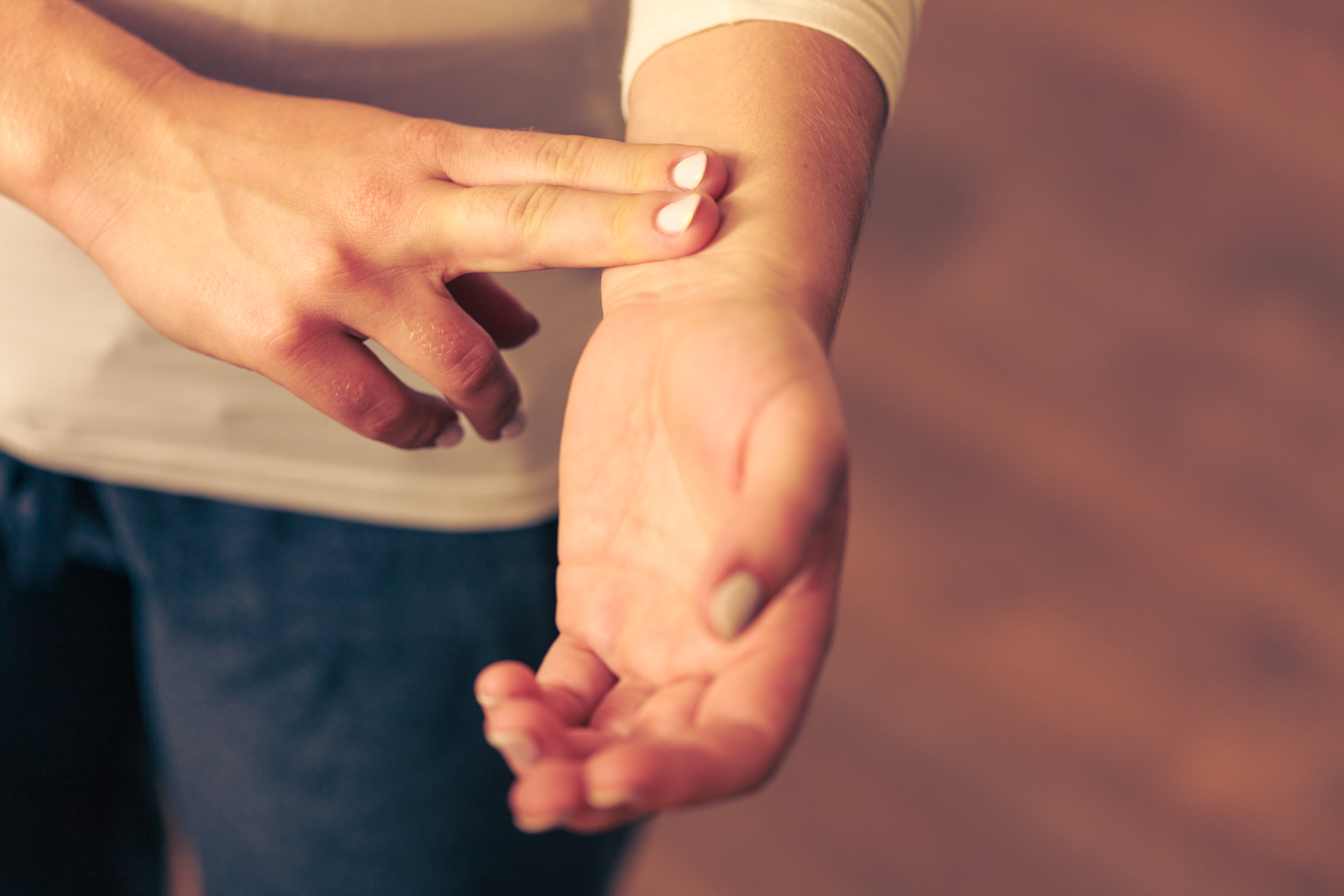 Person checking their pulse.