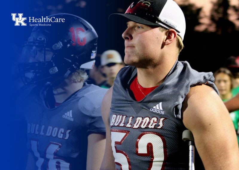 Ethan Hampton standing on the sidelines of a Paul Laurence Dunbar football game