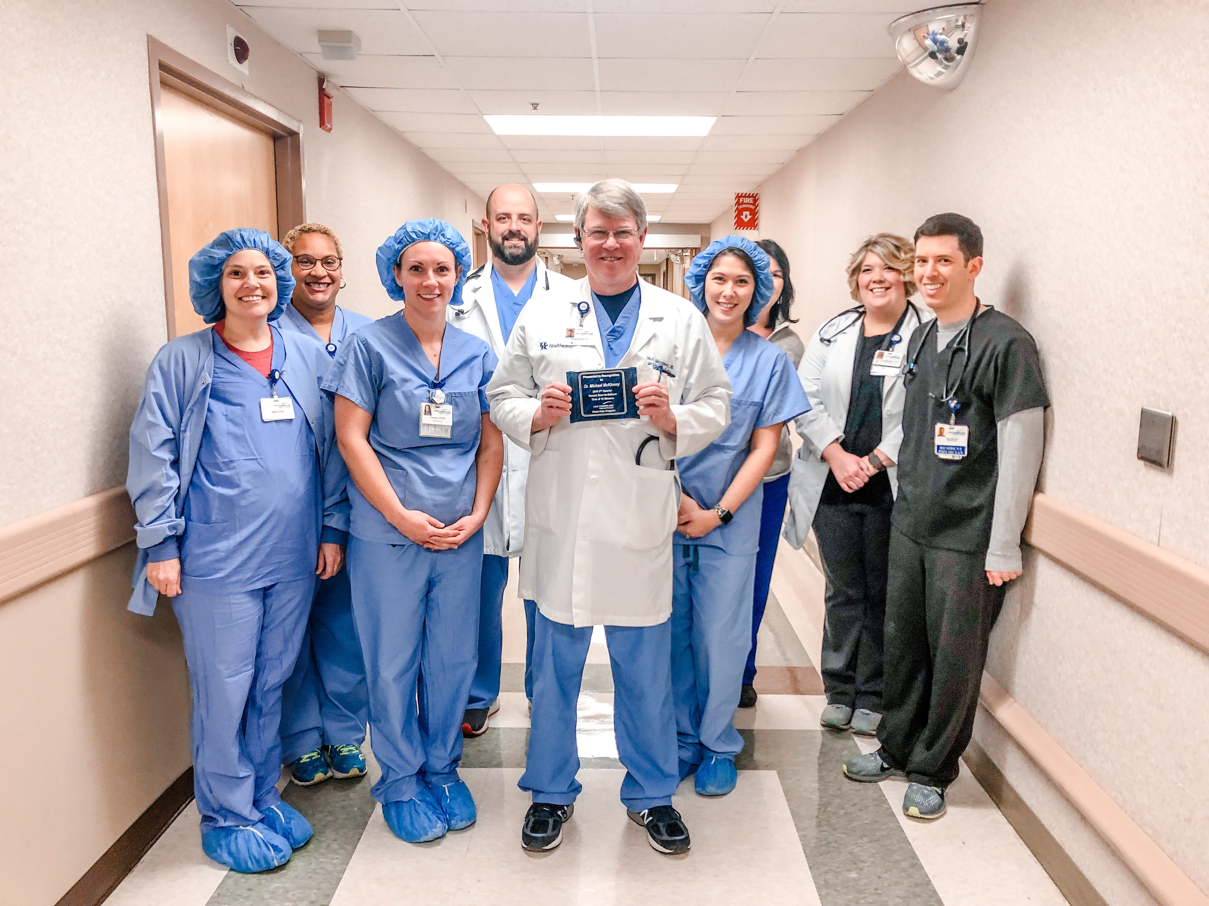 Dr. Michael McKinney, holding an award, flanked by other providers at Lake Cumberland Regional Hospital