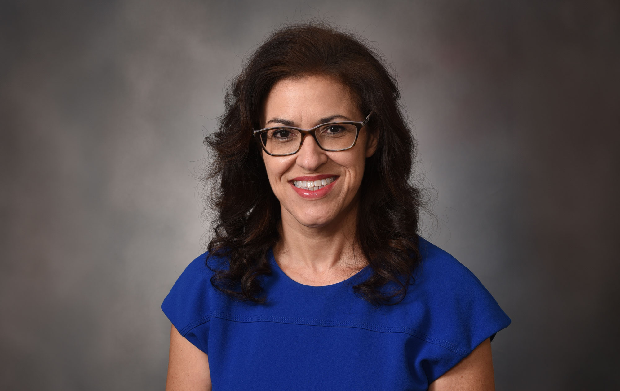 Headshot of Dr. Jessica Lee, who's wearing a blue shirt