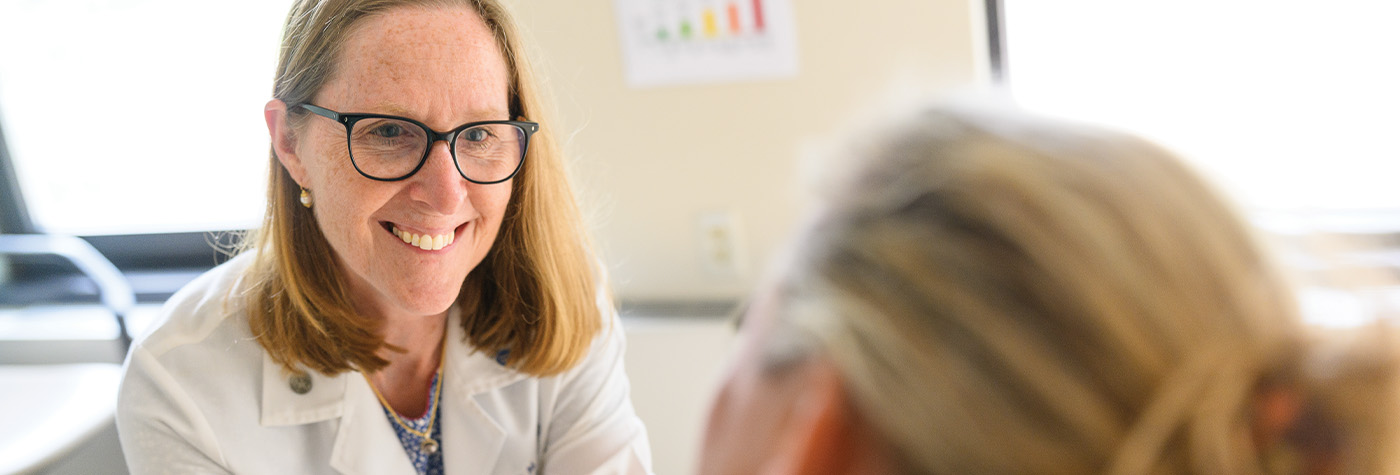 Dr. Susanne Arnold speaks with patient