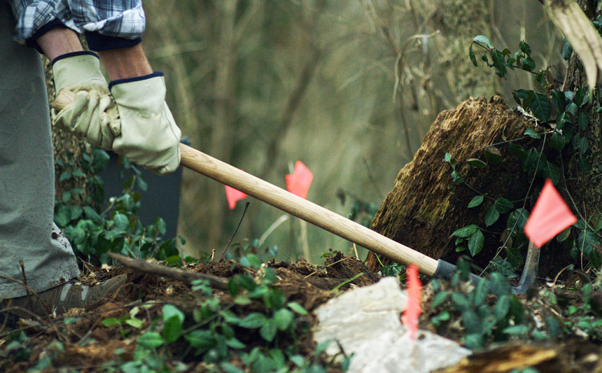 A researcher collects samples from nearby mine.