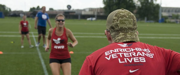 Athletes on a field at training camp.