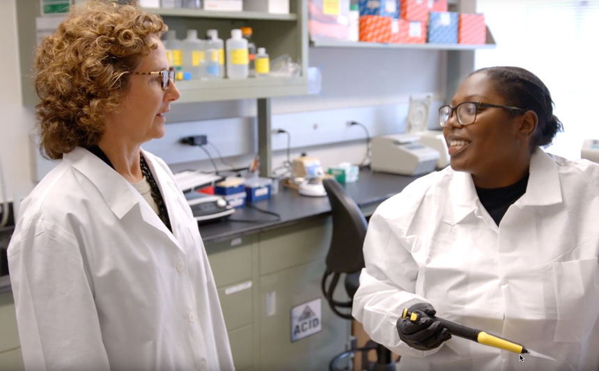 Barbara Nikolajczyk talks with a co-worker.