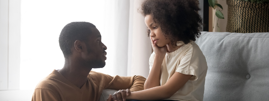 Dad talking to daughter. 