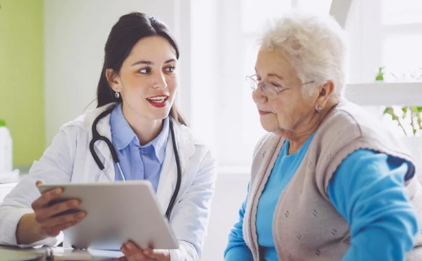 A doctor talks with her patient.