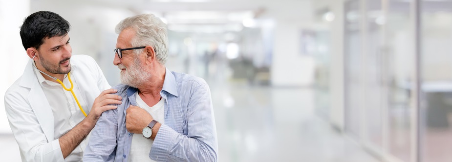 A doctor listens to his stethoscope.