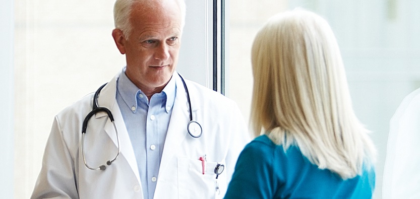 Doctor speaking with patient