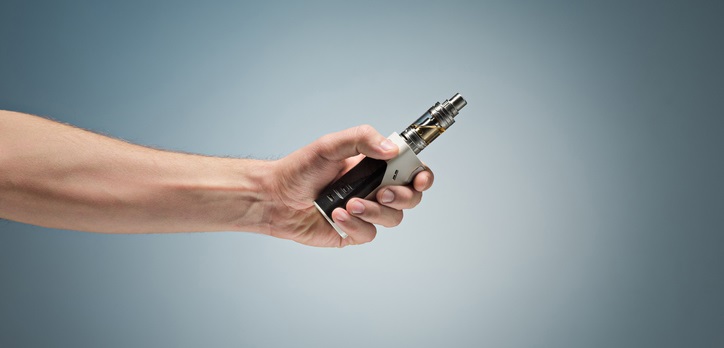 Man holds an e-cigarette.