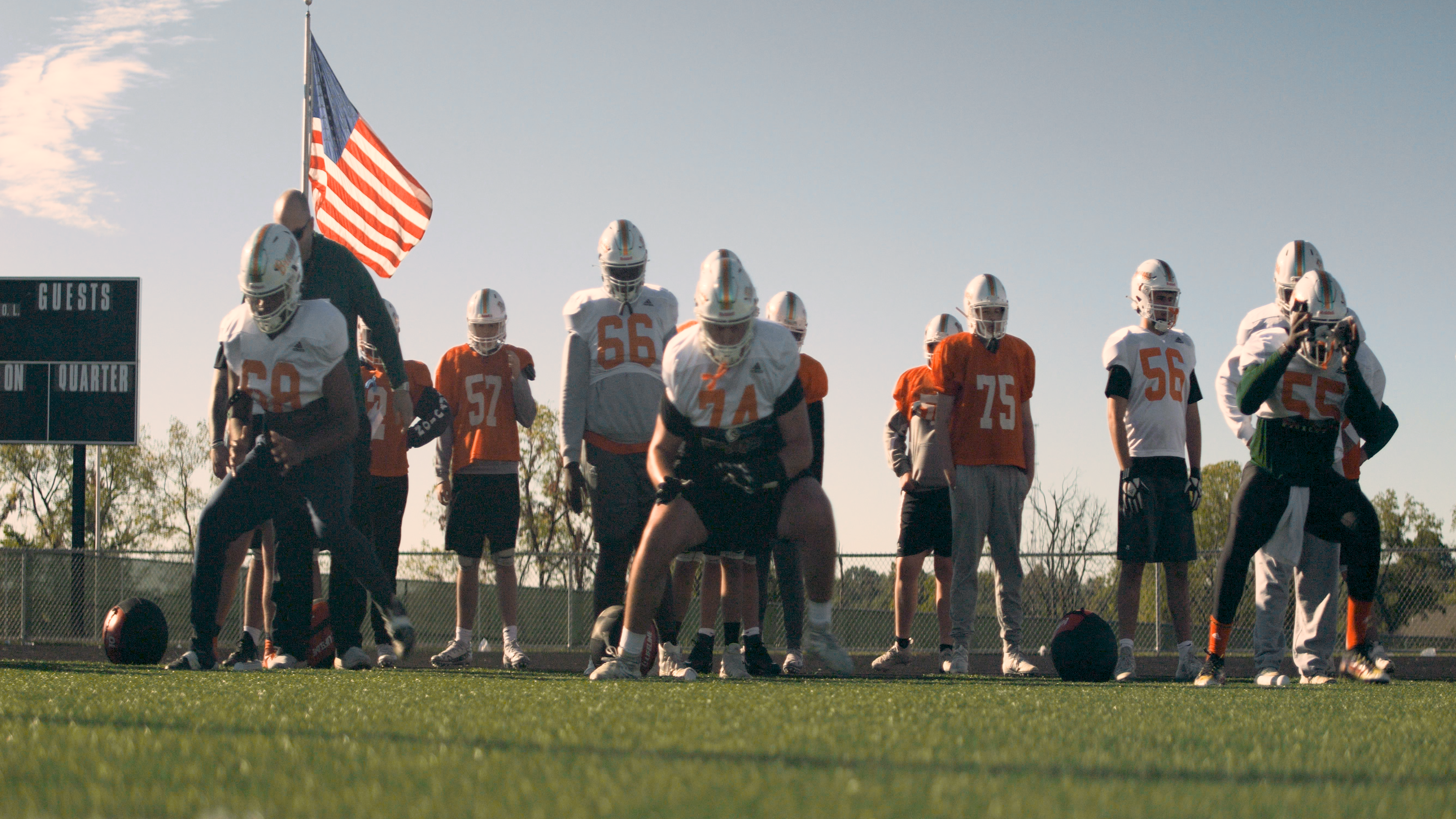 Walker Johnson, a football player at Frederick Douglass High School, practices with his team.