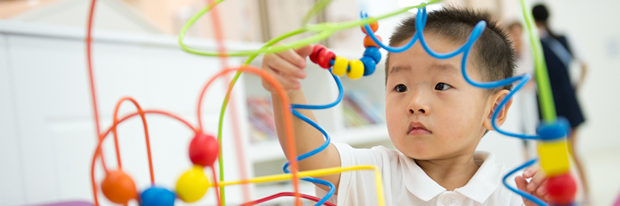 Little boy playing with a puzzle