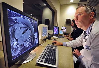 Doctor looking at cardiac imaging scans