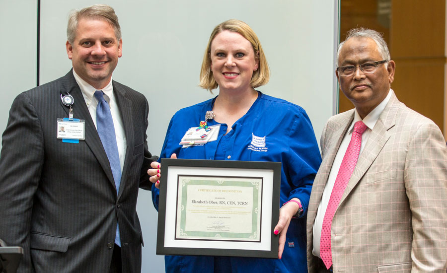 Elizabeth Ober, RN, with Bo Cofield and Dr. Sibu Saha