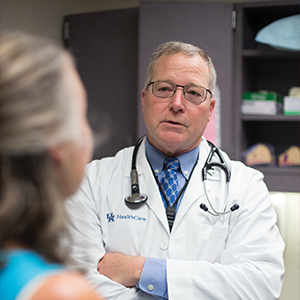 dr. timothy mullet speaks with a patient