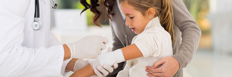 Girl with bandaged burn wounds