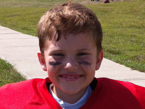 Joey Maggard wearing a red football uniform