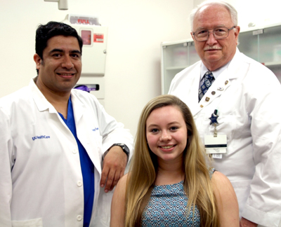 Joy Andrade with Dr. Rodrigo Fuentealba and Dr. Joseph Van Sickels