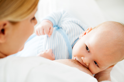 A mother breastfeeds her baby.