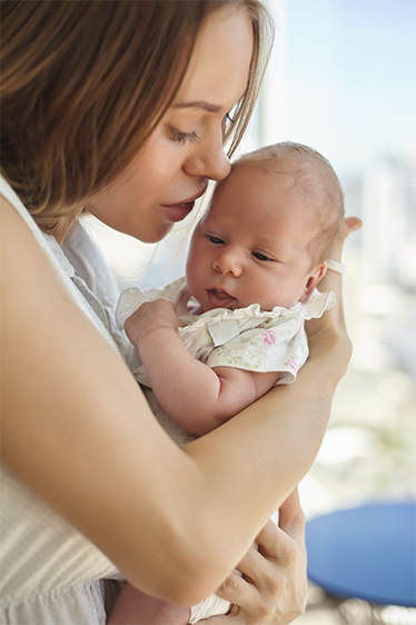 Mother holding her baby