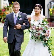 Myrl Sizemore walks his daughter down the aisle at her wedding.