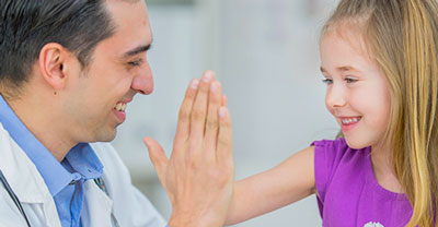 A doctor with a young patient.