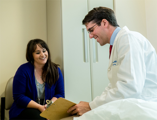 Dr. Reese Randle speaking to patient