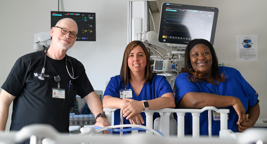 Respiratory therapist Richard Broaddus, RRT, and PICU nurses Ashley Kenley, RN, and Trinaye Pierson, RN.