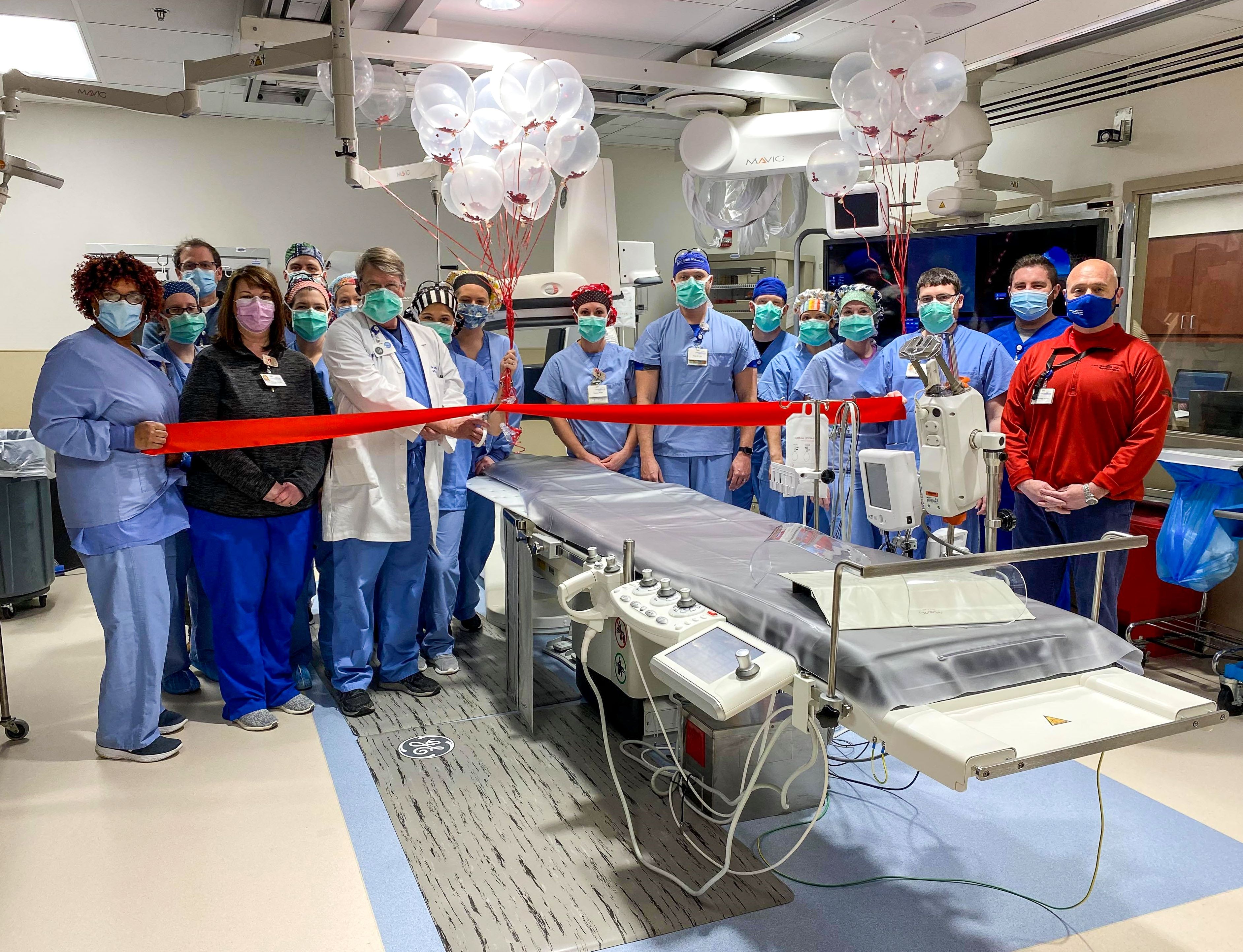 Providers at Lake Cumberland Regional Hospital hold a ribbon cutting for their cath lab.