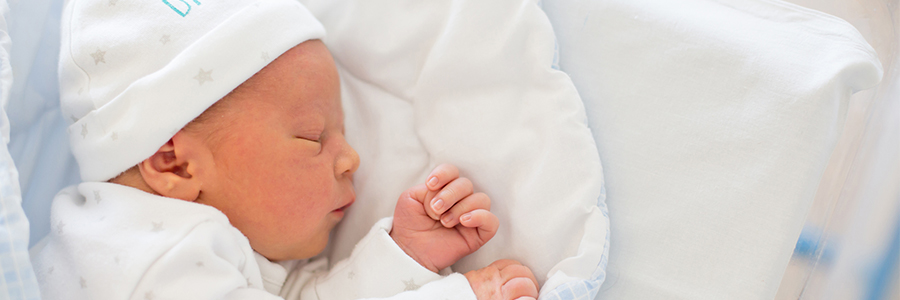 Newborn baby sleeping in crib