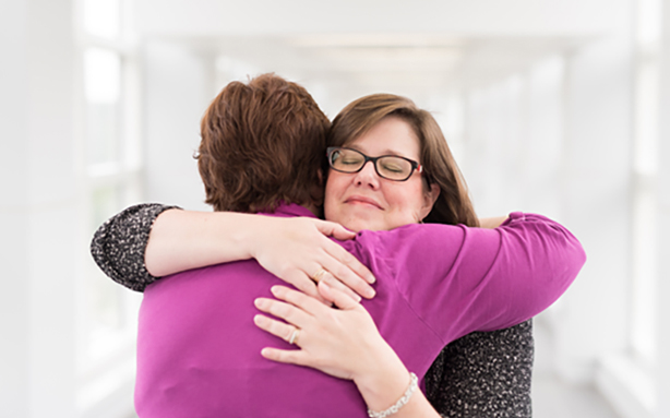 Jennifer Watkins hugs Teresa Schladt.