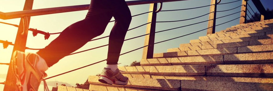 A jogger climbs steps.