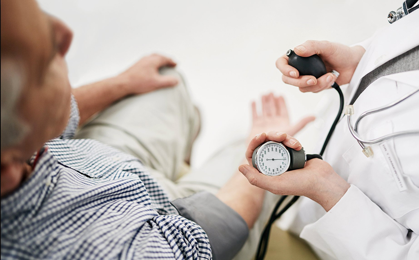 A man has his blood pressure checked.