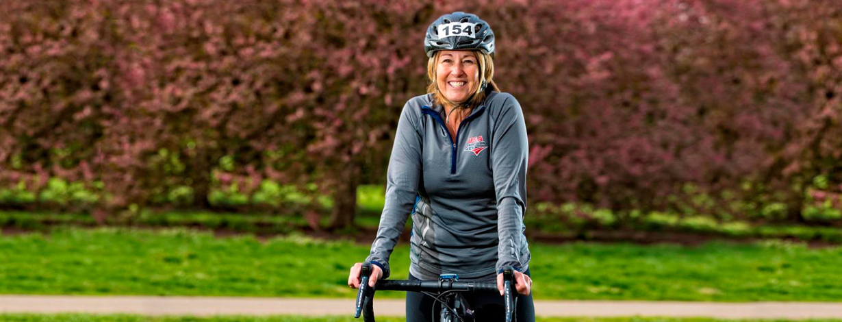 Patty Lane sits astride her bicycle.