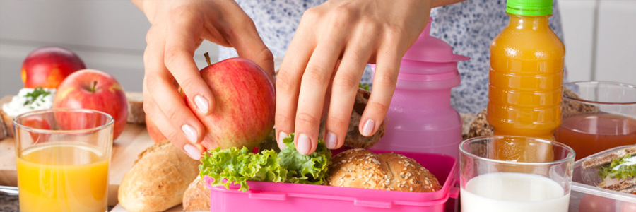 A woman prepares lunch.