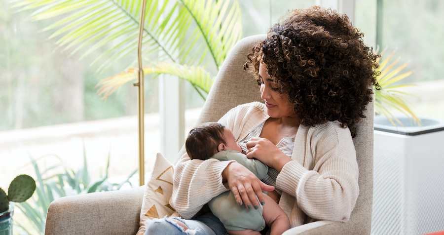 Mother and baby breastfeeding.