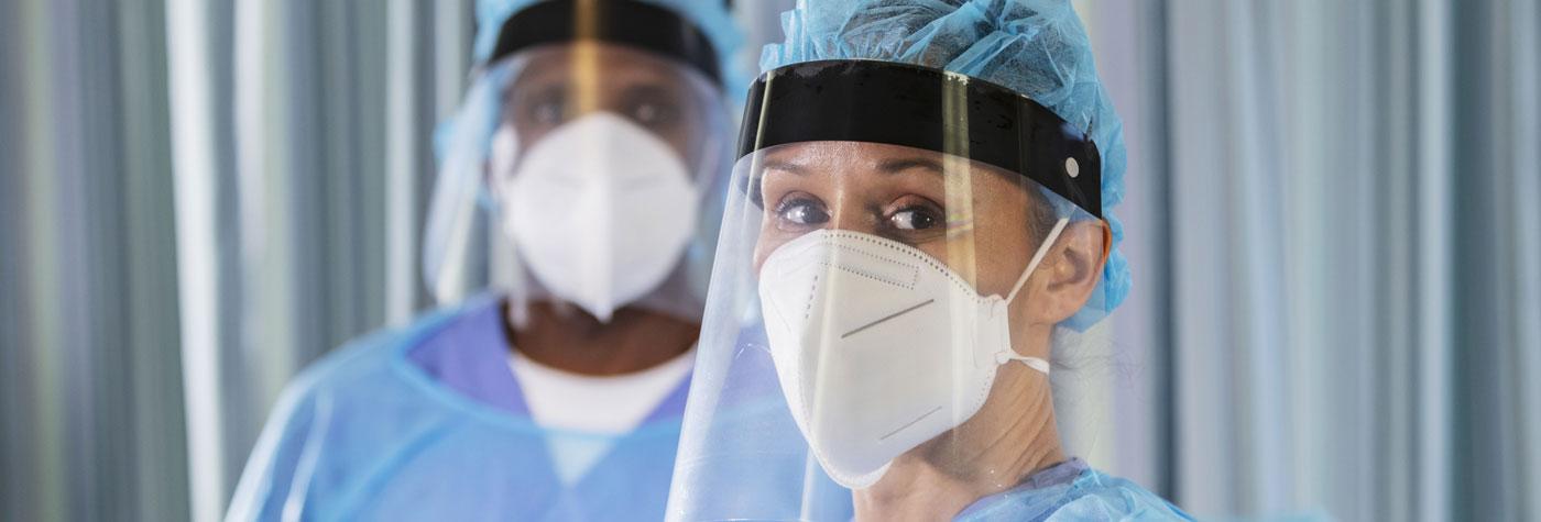 Healthcare providers wearing PPE gear.