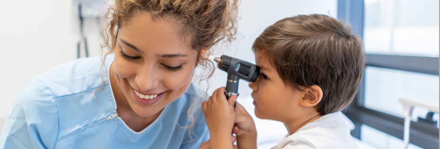 KCH boy and nurse ear check