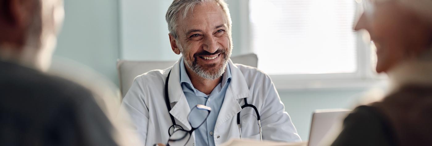 physician smiling while in conversation