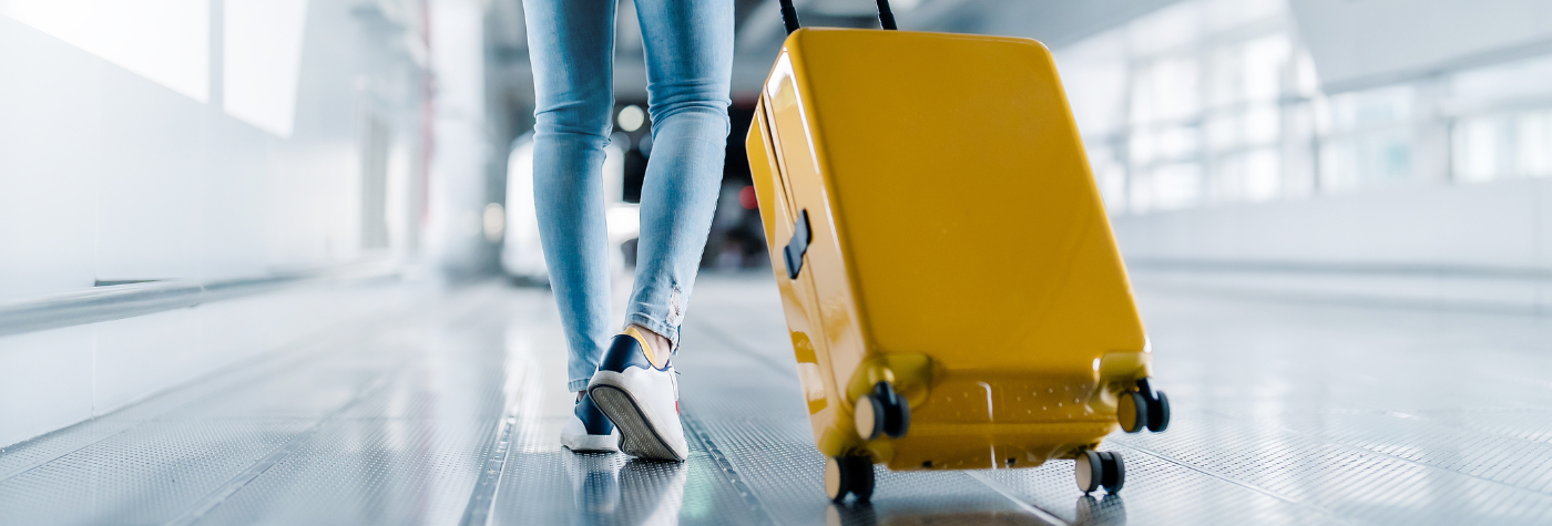 Person walking with suitcase