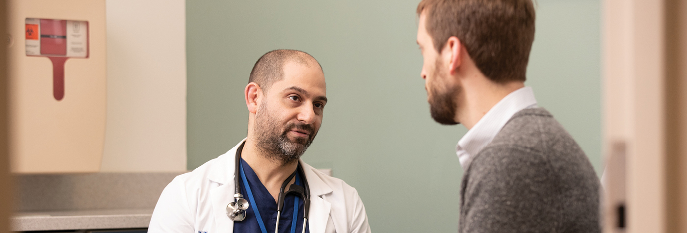 Dr. Andrew Leventhal talks with a patient.