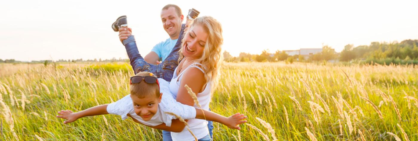 Happy family playing outside