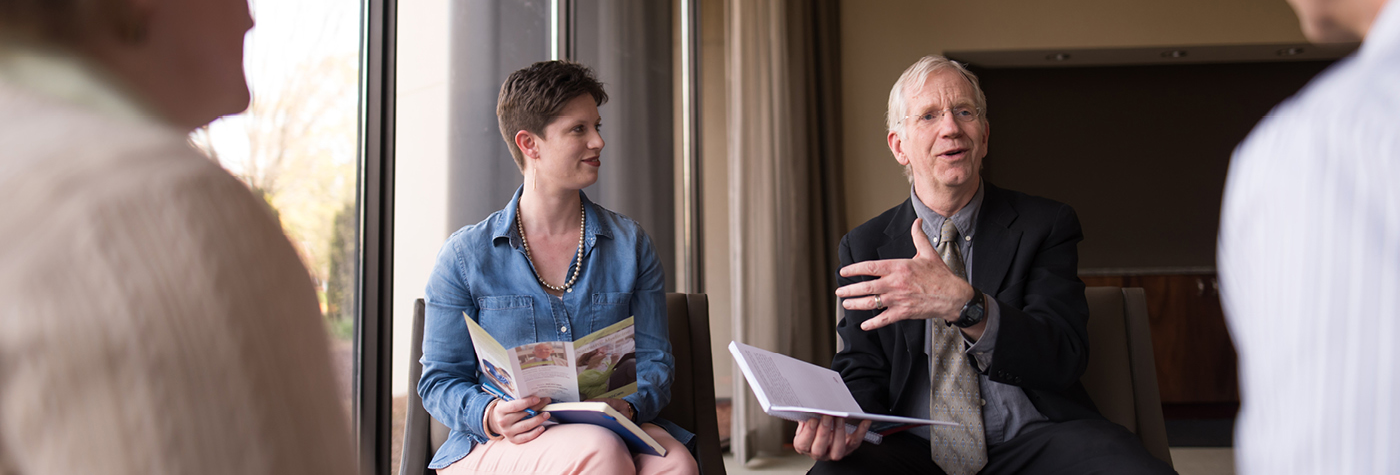 Dr. Robert Slocum leads a group discussion.