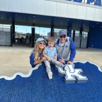 James Fielding and his daughter-in-law and grandson pose for a photo outside Kentucky Proud Park