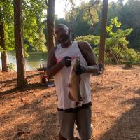 Joshua with a fish he caught.