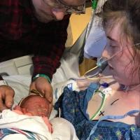 Sarah Custer holds Isabel Custer for the first time.