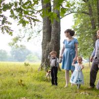 The Custer family walks on the property of their home in Columbia, Ky.