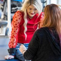 Kayla Lacy looks toward a therapist at the UK HealthCare Outpatient Therapy Clinic.