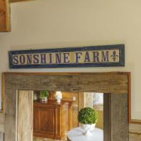 A sign that says Sonshine Farm, the name of Bruce Drake's estate