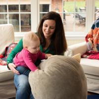 Amberlee plays with her daughter Anna at their home.